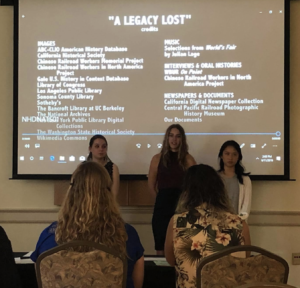 Three students speaking to judges